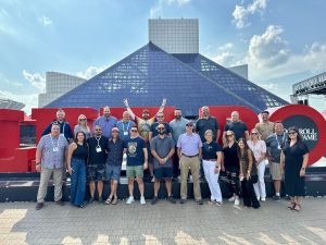 DevX 2025 Attendees in front of rock and Roll Hall of Fame